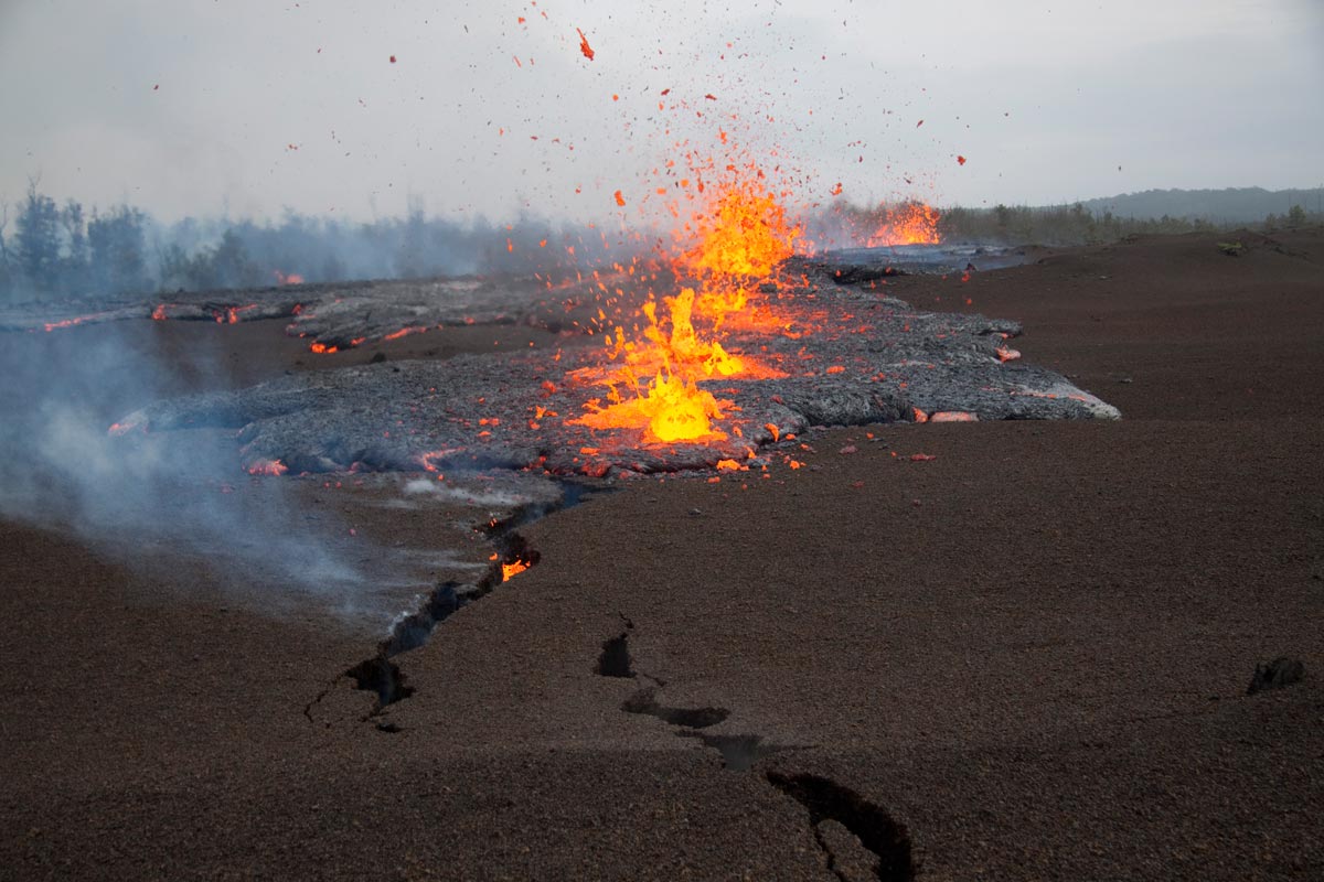 PUBLIC DOMAIN United States Geological Survey: View looking at the NE end of the actively propagating fissure. Lava is just breaking the surface in foreground crack.